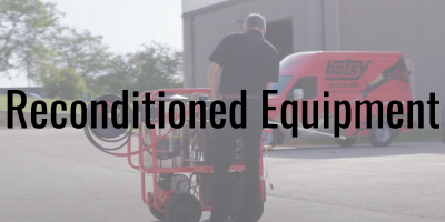 Man reconditioning a hotsy pressure washer with text overlay reading Reconditioned Equipment