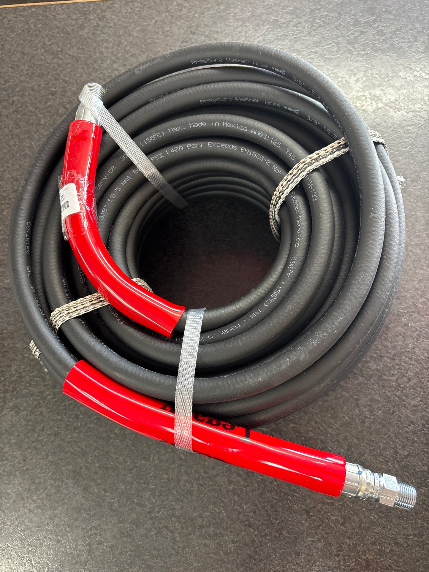2 wire 100 foot pressure hose coiled and tied off