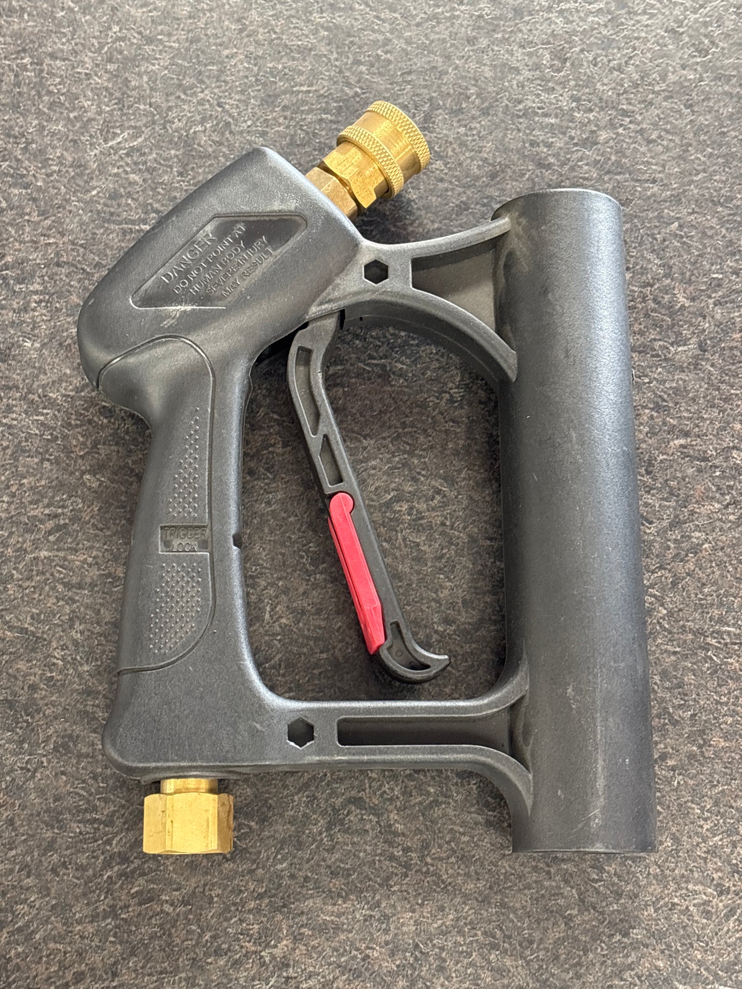 trigger gun resting on floor facing forward