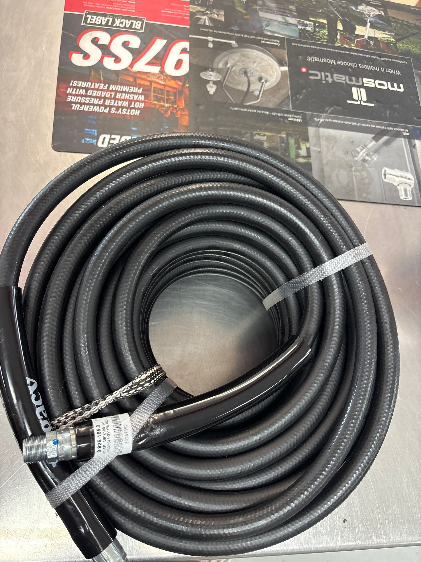 Single wire pressure hose coiled in floor