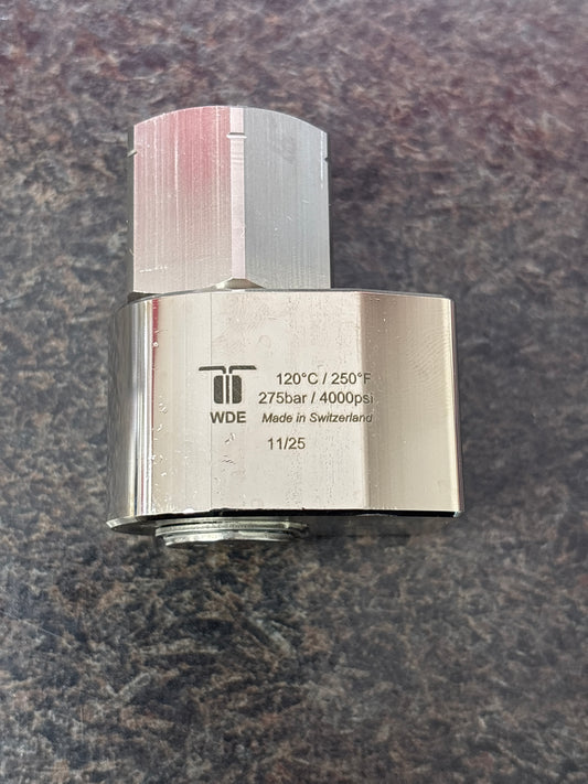 Metallic valve on a textured gray surface