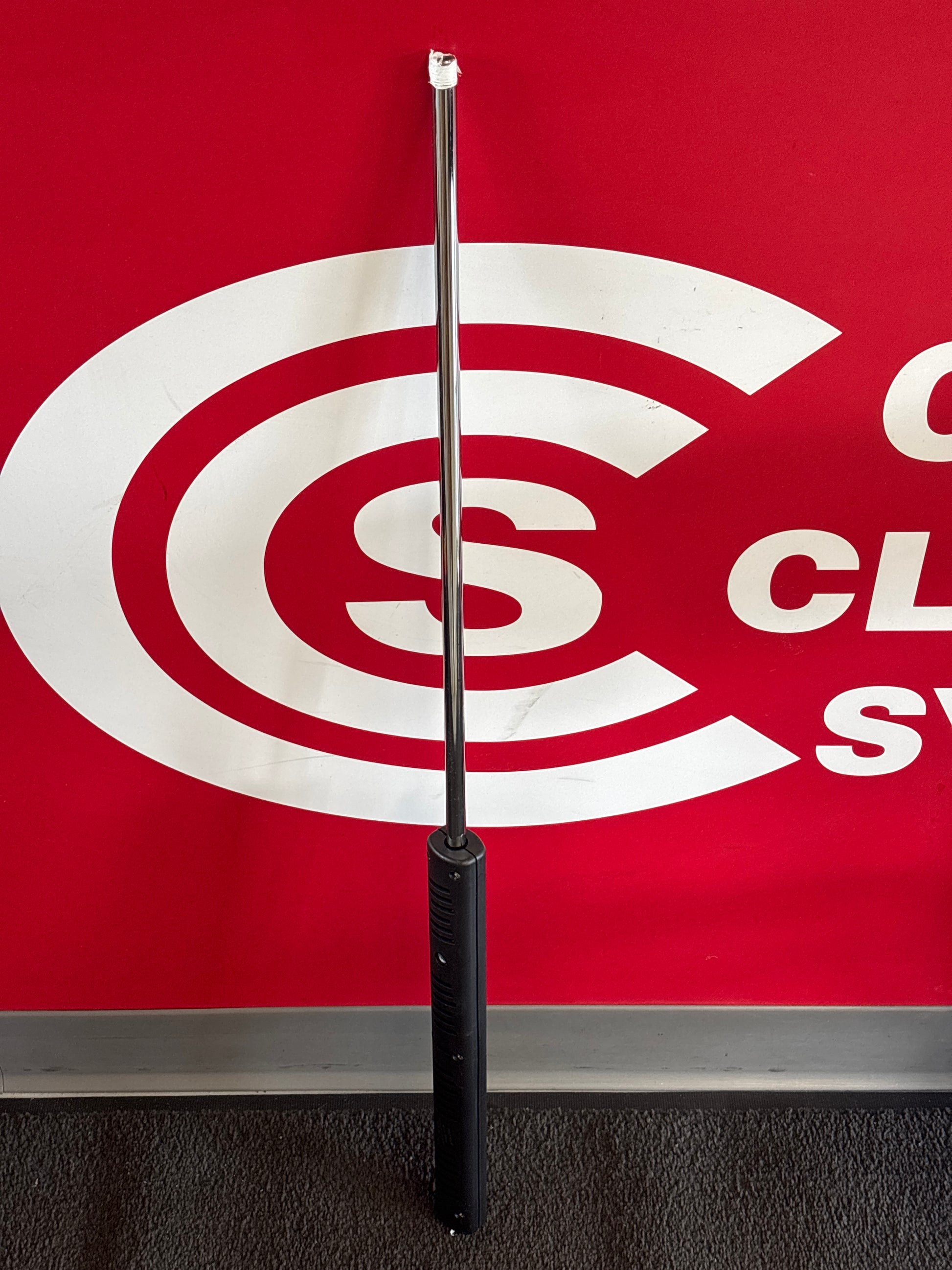 36" Spray Wand against the Central Cleaning logo wall