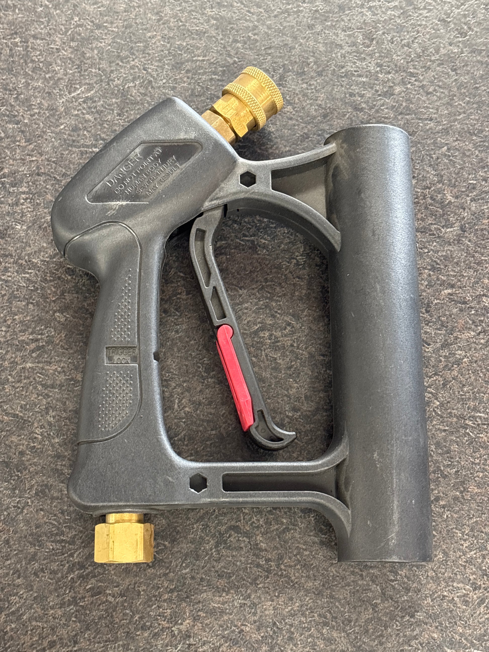 trigger gun resting on floor facing forward