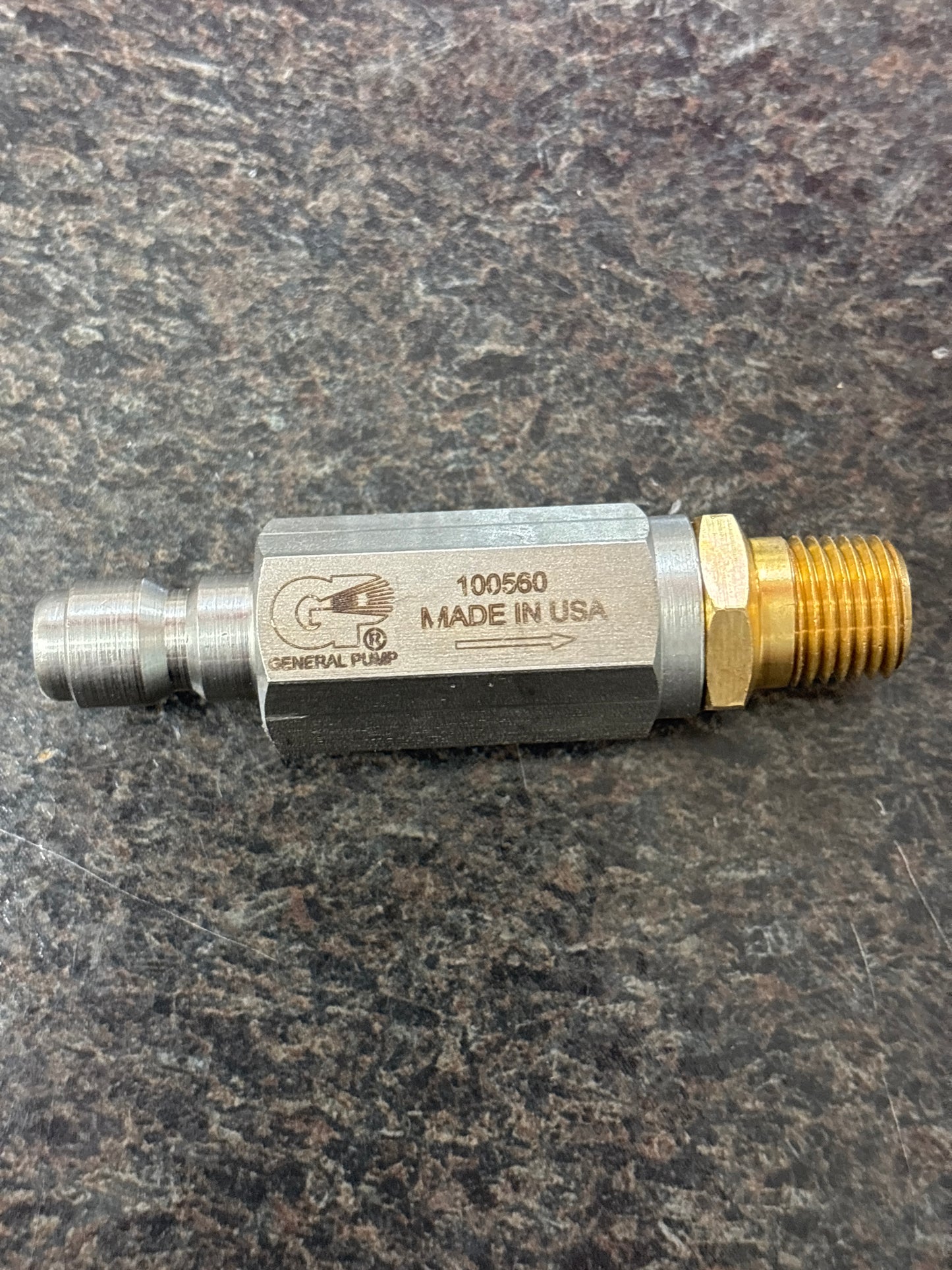 Baren 5000PSI FILTER 1/4QC PLUG X 1/4MPT OUT laying flat with Made In USA imprint