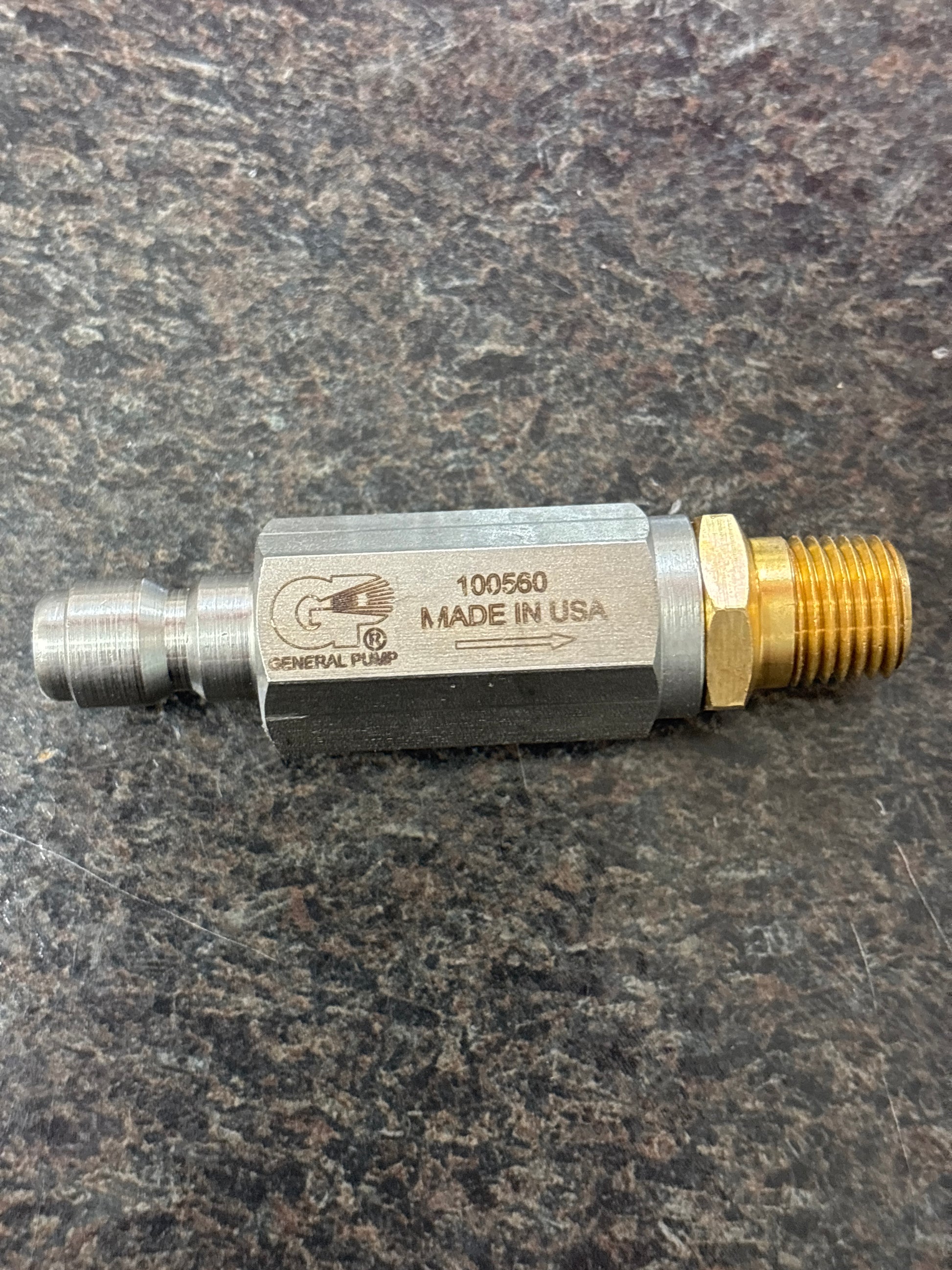 Baren 5000PSI FILTER 1/4QC PLUG X 1/4MPT OUT laying flat with Made In USA imprint
