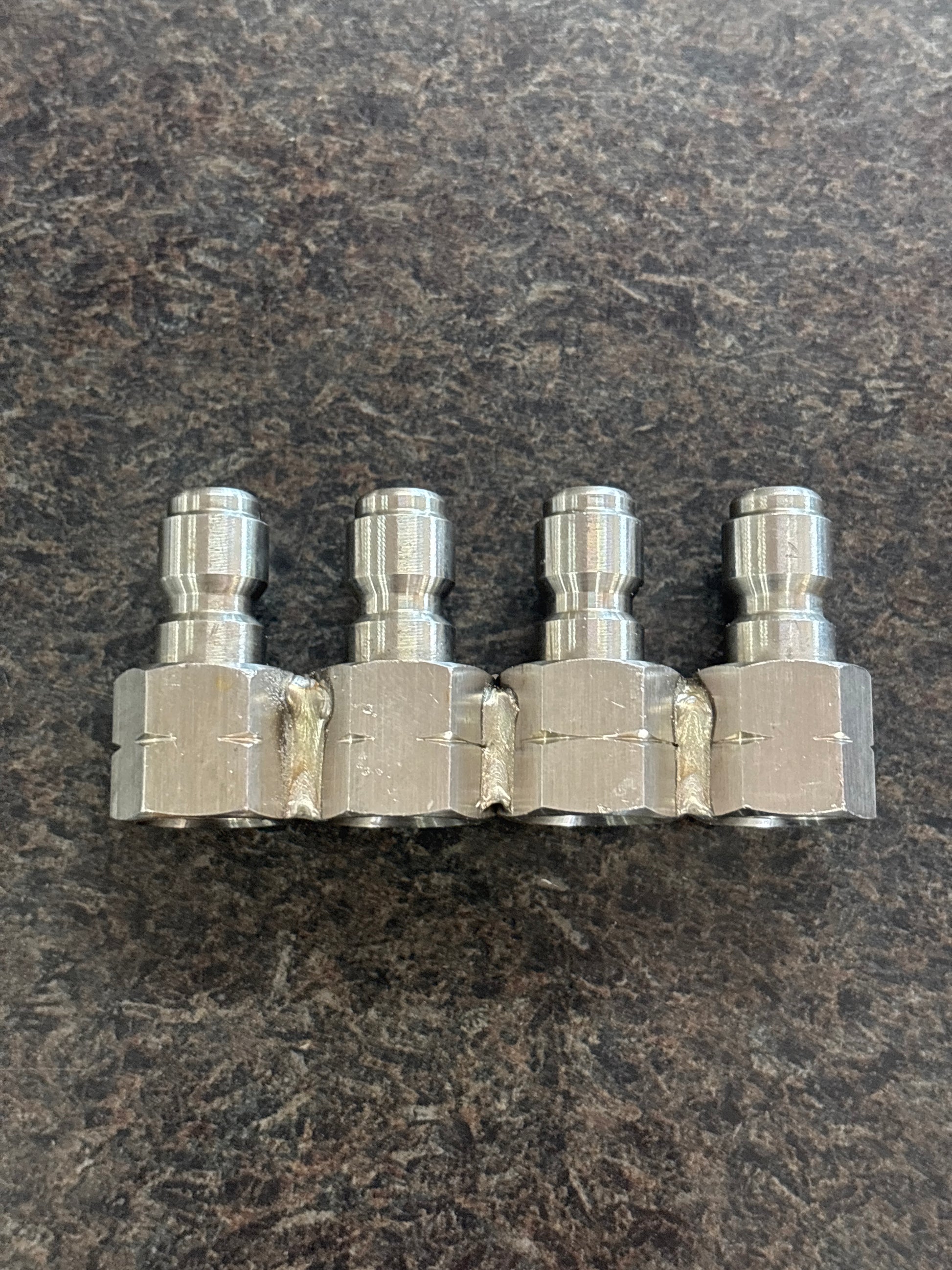Metal valve manifold on a textured dark surface - Product
Baren-JROD 4 WAY S.S. NOZZLE HOLDER (FOR 1/4" MPT NOZZLE