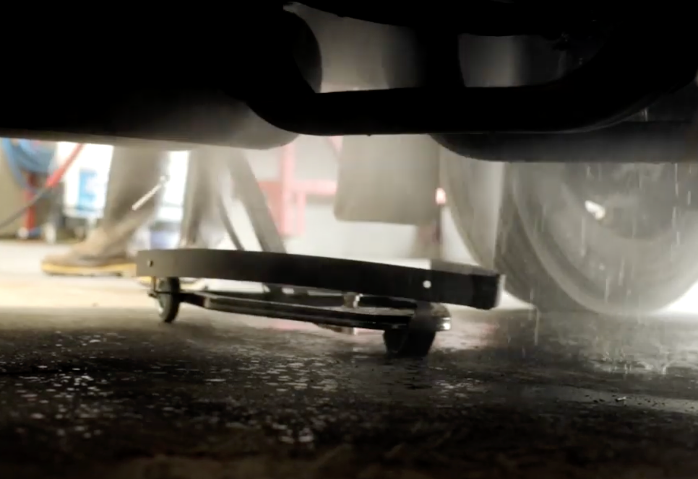 Hotsy under carriage pressure washer under a truck